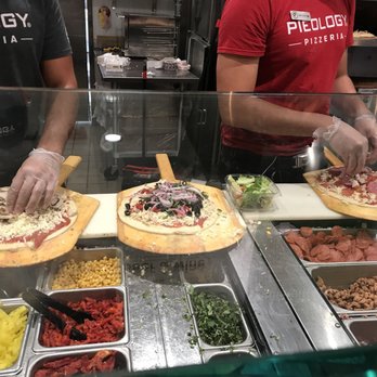 Pieology Pizzeria, Miami, FL - Making pizzas - Pizza Near Me - Miami, Florida Pieology Pizzeria, Miami, FL - Making pizzas - Pizza Near Me - Miami, Florida