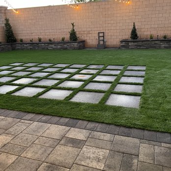 JTB Landscapers - Concrete steppers nestled into artificial grass - Landscape Architects or Designers Near Me - Las Vegas, Nevada
