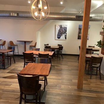 Okome House - a dining area with tables and chairs - Japanese Near Me - Minneapolis, Minnesota