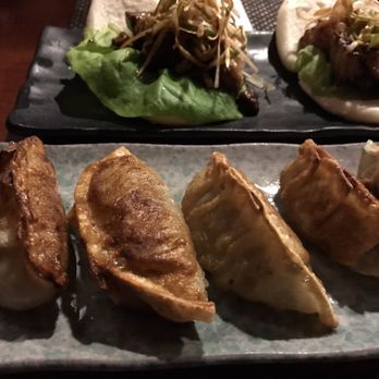 Sakuramen - Fried pork gyoza in the front and chashu buns (pork) in the back - Asian Fusion Near Me - Washington, DC, District of Columbia Sakuramen - Fried pork gyoza in the front and chashu buns (pork) in the back - Asian Fusion Near Me - Washington, DC, District of Columbia