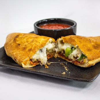 Village Pizza - Works Calzone - Pizza Near Me - Killeen, Texas Village Pizza - Works Calzone - Pizza Near Me - Killeen, Texas