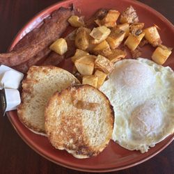 Bacon, eggs, potatoes and an English muffin.