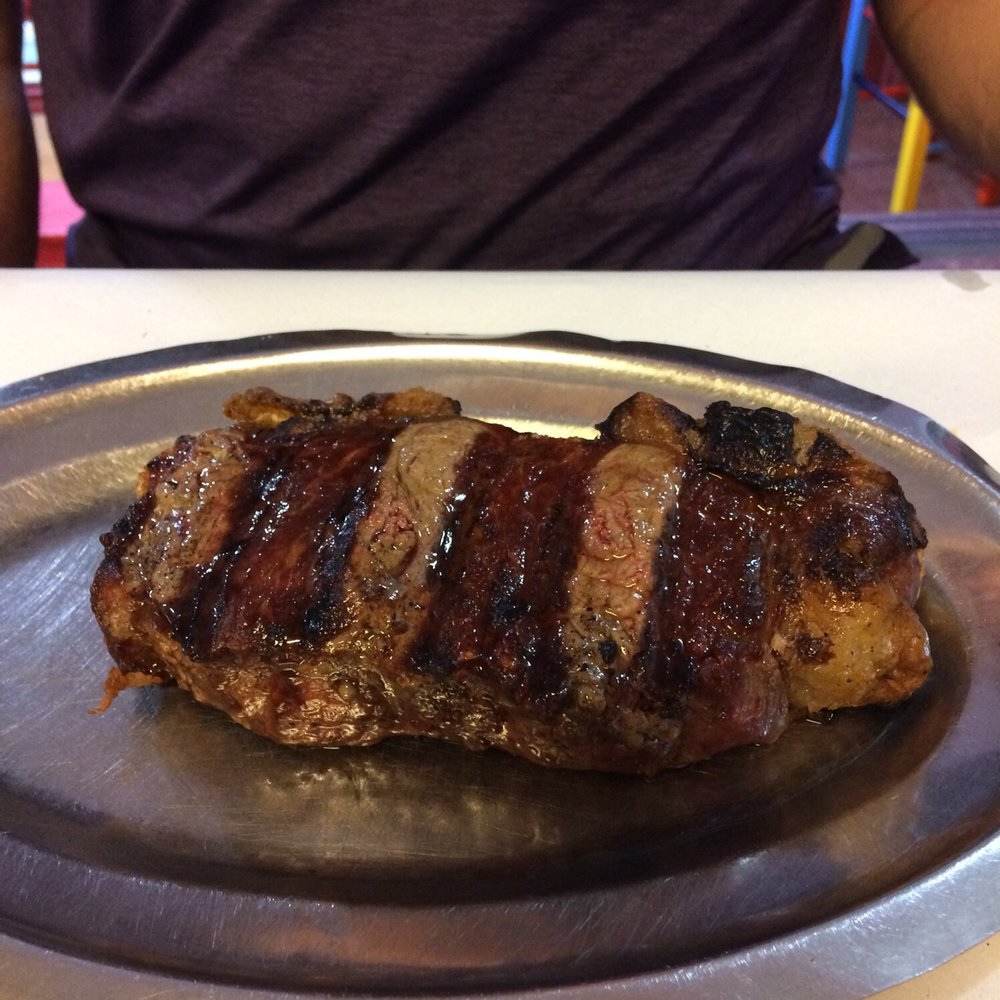 Parrilla Peña - Corte be bife (NY strip in US beef terms) "muy jugoso" - very juicy. Nice red center, great char on outside. - Argentine Near Me - Buenos Aires, C Parrilla Peña - Corte be bife (NY strip in US beef terms) "muy jugoso" - very juicy. Nice red center, great char on outside. - Argentine Near Me - Buenos Aires, C