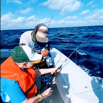 Kay Tours Mexico - The crew helping to teach us our to fish. - Snorkeling Near Me - Playa del Carmen, ROO Kay Tours Mexico - The crew helping to teach us our to fish. - Snorkeling Near Me - Playa del Carmen, ROO