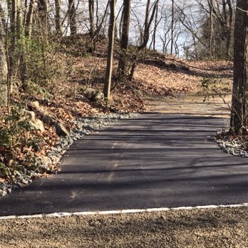 Cross Paving - Paved driveway with Belgium block on each end to prevent wear and tear and washout. Also stone on the sides to slow erosion. - Masonry/Concrete Near Me