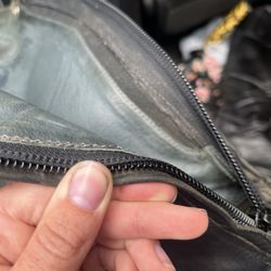 The Shoe Master - Loose stitching attaching zippers to boots