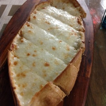 Lezzet cafe - Turkish cheese pizza, they official name is not that but their menu includes pictures - Mediterranean Near Me - Dallas, Texas