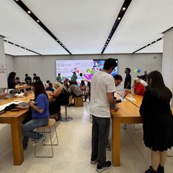 Apple Brea Mall - Back tables for Vision Pro demo, personal setup and Genius Bar by the video wall