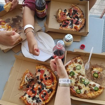 Pizza Zazza - a group of people eating pizza - Pizza Near Me - Las Vegas, Nevada Pizza Zazza - a group of people eating pizza - Pizza Near Me - Las Vegas, Nevada