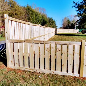 Don The Builder - a wooden fence in a yard - Flooring Near Me