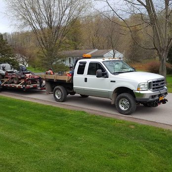 Smith's Lawn and Landscape - a flatbed truck hauling a lawn - Landscaping Near Me Smith's Lawn and Landscape - a flatbed truck hauling a lawn - Landscaping Near Me