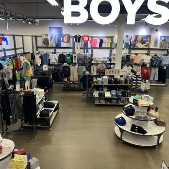 Old Navy - A boys' clothing section at Old Navy in Broomfield, CO, featuring racks of shirts, pants, and mannequins dressed in casual wear. - Men's Clothing Near Me - Broomfield, Colorado
