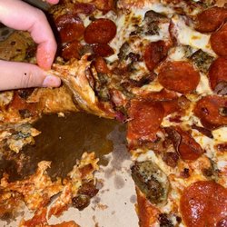 Domino's Pizza - 2/2 (same slice) pizza is so thin that it ripped because of the sauce and toppings