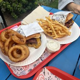 Onion rings and regular well done fries with the same burger. One a double burger the other one is a single.