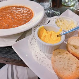 a bowl of soup and bread