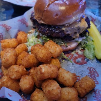 Bubba's 33 - Double cheeseburger with Tatar tots with a quarter sliced Dill pickle. - American Near Me - San Antonio, Texas