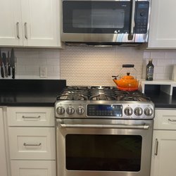 Mike Giroux Tile - This shows the backsplash in my kitchen with a decorative tile behind the stove and subway tile around it. I love it!