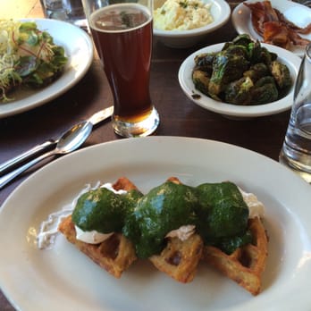 The Smith - Potato waffle Benedict with bacon, Brussels sprouts, jalapeño cheddar grits, and smuttynose brown dog - New American Near Me - New York, New York