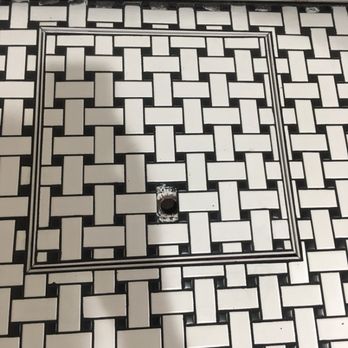Phenomenal - a black and white tiled floor - General Contractors Near Me Phenomenal - a black and white tiled floor - General Contractors Near Me