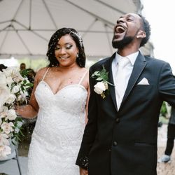 Mindy Joy Photography - Bride and groom joyfully celebrating just being married at Nicholas Conservatory in Rockford IL.