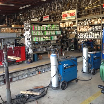 Ed Hanson's Muffler Service - drill press, mig welders, parts in the back ground - Auto Repair Near Me - Spring Valley, California