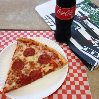 Cheezers Pizzeria - a slice of pizza on a paper plate - Pizza Near Me - Port Dover, Ontario Cheezers Pizzeria - a slice of pizza on a paper plate - Pizza Near Me - Port Dover, Ontario