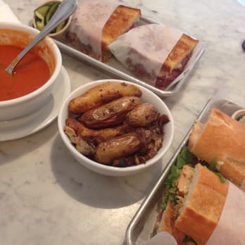 Joan's on Third - Center: Fingerling Potatoes. Right: Tomato Soup. Top: Short Rib Grilled Cheese. Left: Maple Rosemary Chicken Sandwich - Breakfast & Brunch Near Me - Los Angeles, California Joan's on Third - Center: Fingerling Potatoes. Right: Tomato Soup. Top: Short Rib Grilled Cheese. Left: Maple Rosemary Chicken Sandwich - Breakfast & Brunch Near Me - Los Angeles, California