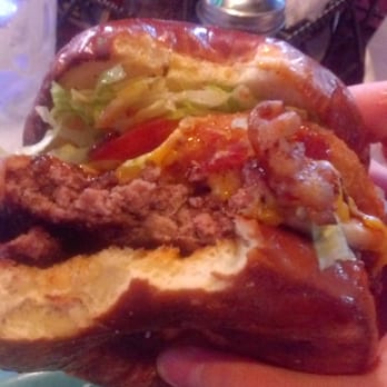 Panini's Bar & Grill - Close up view of burger. - New American Near Me - Kent, Ohio Panini's Bar & Grill - Close up view of burger. - New American Near Me - Kent, Ohio
