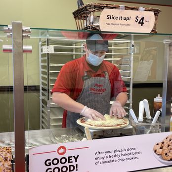 Papa Murphy's - Our cheesy pizza and one of the pizza makers - Pizza Near Me - Greensboro, North Carolina Papa Murphy's - Our cheesy pizza and one of the pizza makers - Pizza Near Me - Greensboro, North Carolina