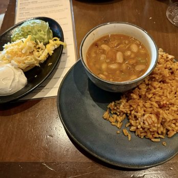 Uncle Julio's - Sides that came with the carne asada. Rice, beans, sour cream, cheese and guac. - Mexican Near Me - Ashburn, Virginia Uncle Julio's - Sides that came with the carne asada. Rice, beans, sour cream, cheese and guac. - Mexican Near Me - Ashburn, Virginia