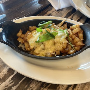 The General Public - They call these hash browns. The cheese and green chili on them is amazing!! - New American Near Me - San Antonio, Texas The General Public - They call these hash browns. The cheese and green chili on them is amazing!! - New American Near Me - San Antonio, Texas