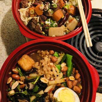 R' Noodles - wo bowls of food with chopsticks - Chinese Near Me - Oakland, California R' Noodles - wo bowls of food with chopsticks - Chinese Near Me - Oakland, California