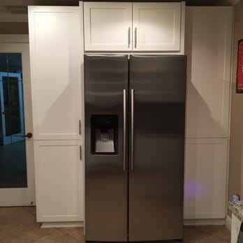 Saba Construction - a stainless steel refrigerator in a kitchen - General Contractors Near Me - Miami, Florida
