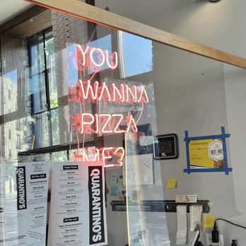 Quarantino's - a neon sign in a window - Pizza Near Me - Grand Rapids, Michigan Quarantino's - a neon sign in a window - Pizza Near Me - Grand Rapids, Michigan