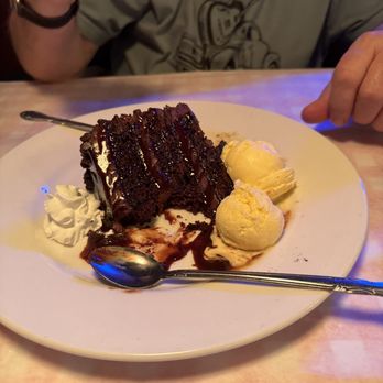 Manny's Original Chophouse - Chocolate cake with mini chocolate chips on side. - Steakhouses Near Me - Winter Haven, Florida