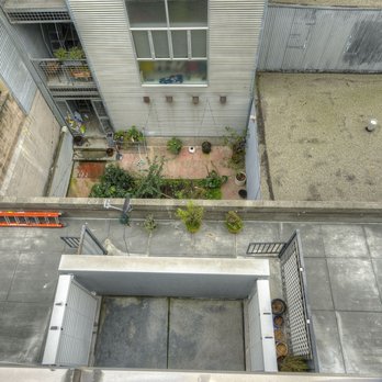 Jon Hornstra - Eccleston - Courtyard and exterior view of Dogpatch condo designed by famed architect Stanley Saitowitz. - Real Estate Agents Near Me - Pacifica, California Jon Hornstra - Eccleston - Courtyard and exterior view of Dogpatch condo designed by famed architect Stanley Saitowitz. - Real Estate Agents Near Me - Pacifica, California