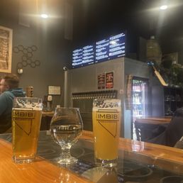 White wine. Pan is Alive beer & Playa Dust...plus the menu.