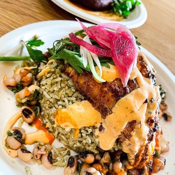 Vic & Al's - Blackened Catfish with Morita Chili Rub over Sassafras Rice and Fried Boudin in the back. - Cajun/Creole Near Me - Austin, Texas Vic & Al's - Blackened Catfish with Morita Chili Rub over Sassafras Rice and Fried Boudin in the back. - Cajun/Creole Near Me - Austin, Texas