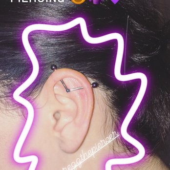 Outer Limits Tattoo & Body Piercing - Customized industrial piercing with blue hinge point and purple end screws! - Tattoo Near Me - Costa Mesa, California