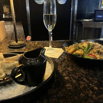 P.F. Chang's - Glass of Prosecco. Pan seared dumplings. Singapore Street Noodles - Chinese Near Me - White Plains, New York P.F. Chang's - Glass of Prosecco. Pan seared dumplings. Singapore Street Noodles - Chinese Near Me - White Plains, New York