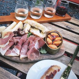 Wine flight - 2 whites, rose, red.   Board - Jamon Serrano, manchego cheese & muscles