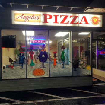 Angela's Pizzeria - View from outside on a snowy rainy evening. - Pizza Near Me - Islip, New York Angela's Pizzeria - View from outside on a snowy rainy evening. - Pizza Near Me - Islip, New York