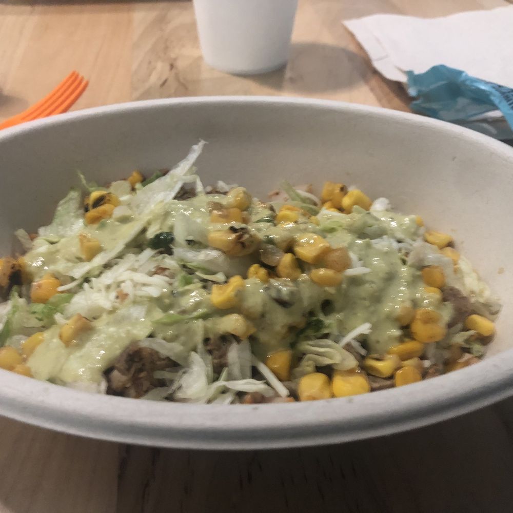 A bowl with chicken and steak A bowl with chicken and steak