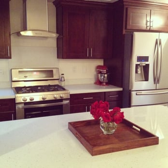 Cb Process Corporation - After - Kitchen. We had Andre move the refrigerator and open up the kitchen by creating an island. - General Contractors Near Me