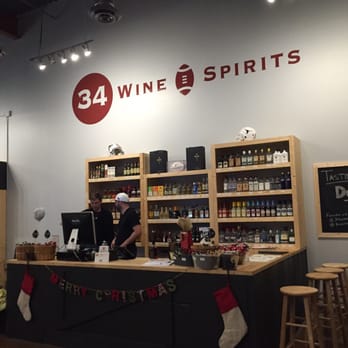 34 Wine and Spirits - a man behind the counter - Beer, Wine & Spirits Near Me - Austin, Texas