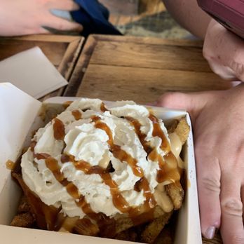 The Big Cheese Poutinerie - Dessert poutine.  Sweet potatoes mixed with cinnamon & sugar, Carmel drizzle & whipped cream. - Poutineries Near Me - Calgary, Alberta