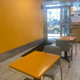 a yellow table and chairs
