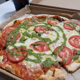 Dillon James MOD with pesto drizzle finishing sauce