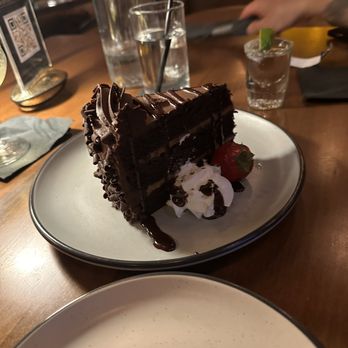 Fumée  - Chocolate cake. They brought it out with a sparkler bc it was his birthday - Cocktail Bars Near Me - Charlotte, North Carolina