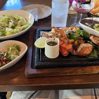 Mexican Sugar Dallas Uptown - Scallop, Shrimp & Lobster Tail Fajitas with a caesar salad - Latin American Near Me - Dallas, Texas Mexican Sugar Dallas Uptown - Scallop, Shrimp & Lobster Tail Fajitas with a caesar salad - Latin American Near Me - Dallas, Texas
